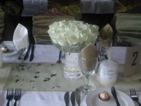 Centrepiece white roses in mushroom vase, Constantia Nek restaurant